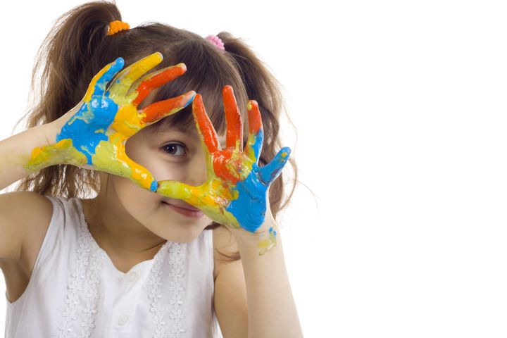 Mills Montessori Student paint on her hands
